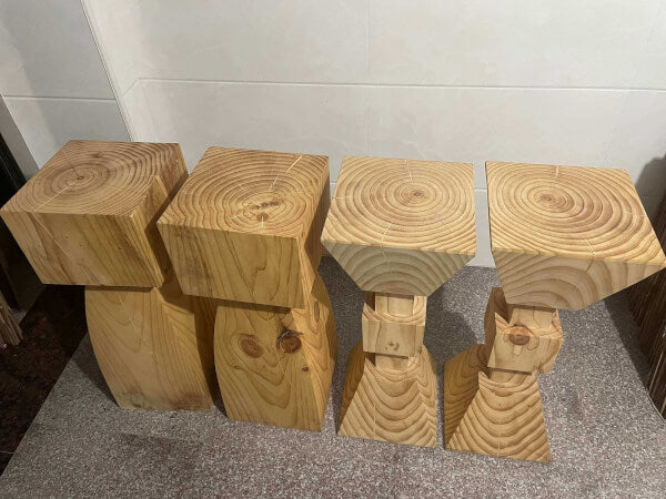 Set of 4 natural solid wood kitchen stools with visible grain patterns.